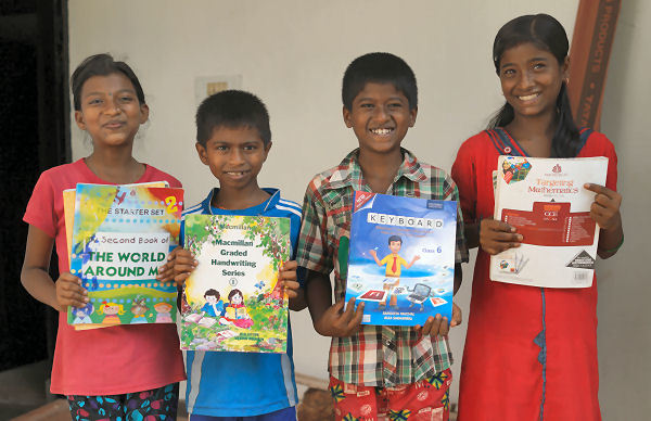 Children with their donated School Books