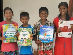 Children with their donated School Books
