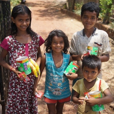 Children receiving their donations from Nestle