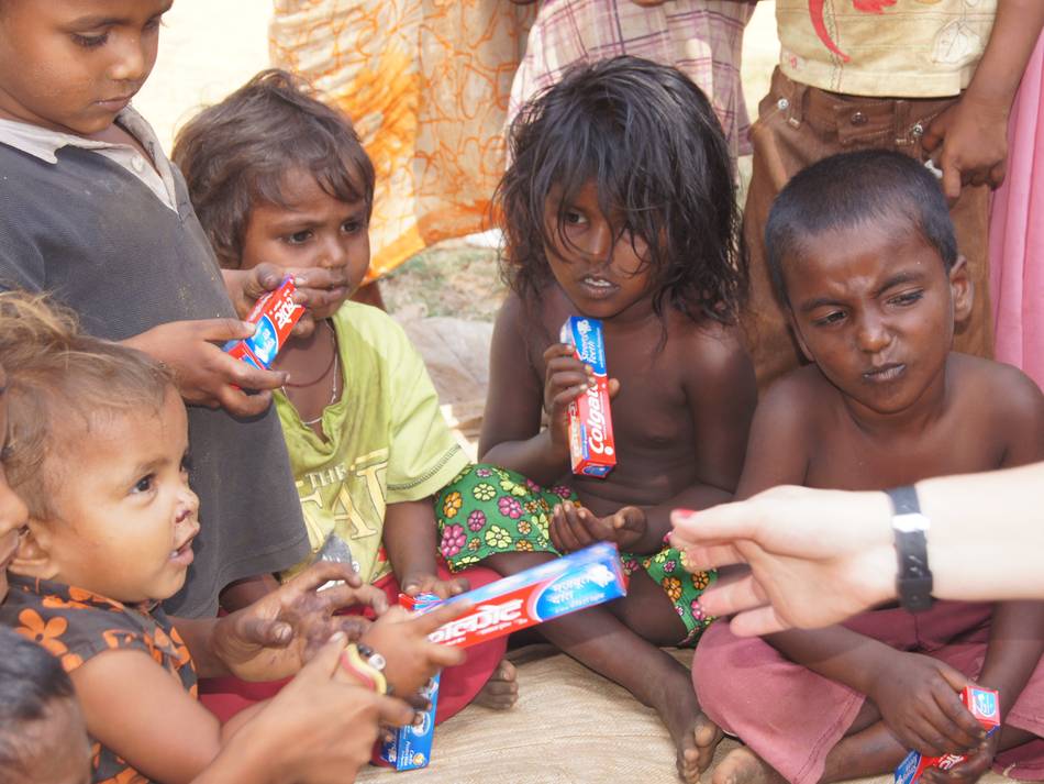 Giving Out Colgate To Street Kids
