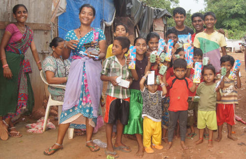 Group of children with their monthly donations