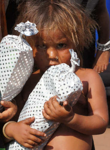 A street child who received a Christmas present last year.