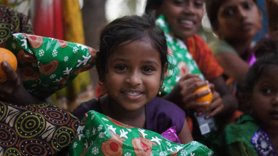 Children receiving their Christmas gifts the day after Christmas.