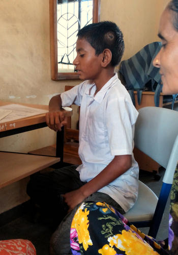 Sahil speaking to the teacher during the admission process.