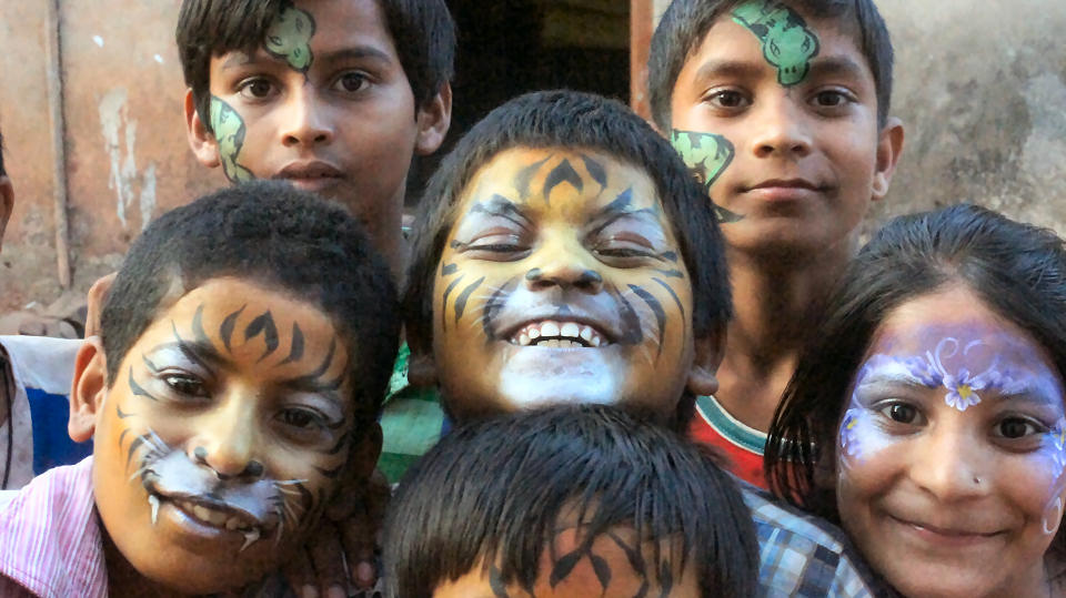 A selection of children with their faces painted2015/03-Naomi-Painting-Faces.jpg|Naomi transforming one of the children into a tiger
