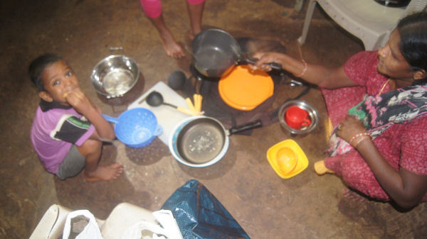 Donations of Pots and Pans Being Distributed in the Slums