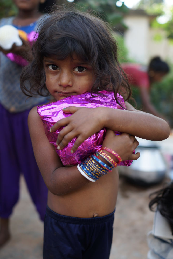 A Girl Holiding Present Tightly