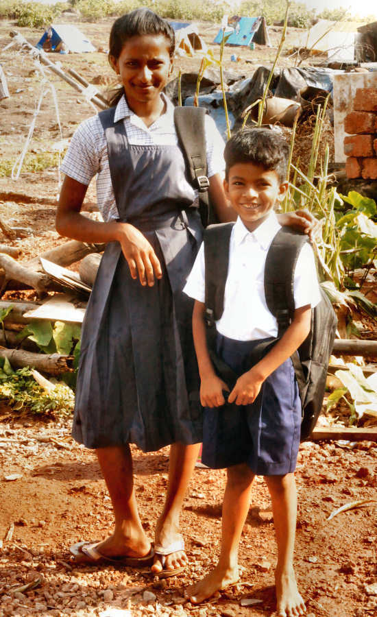 Children In Uniform Near Slum