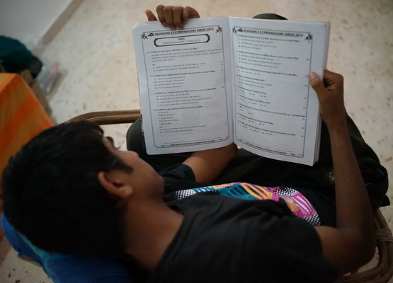 One of the 10th Standard Students Revising before his exam