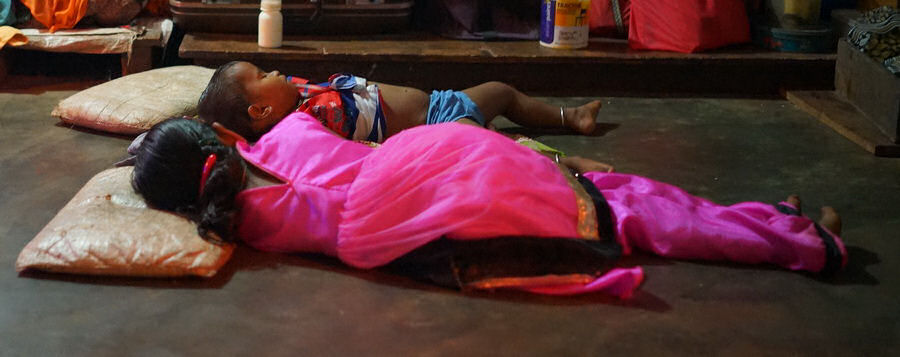 Children Sleeping on the floor to keep cool.