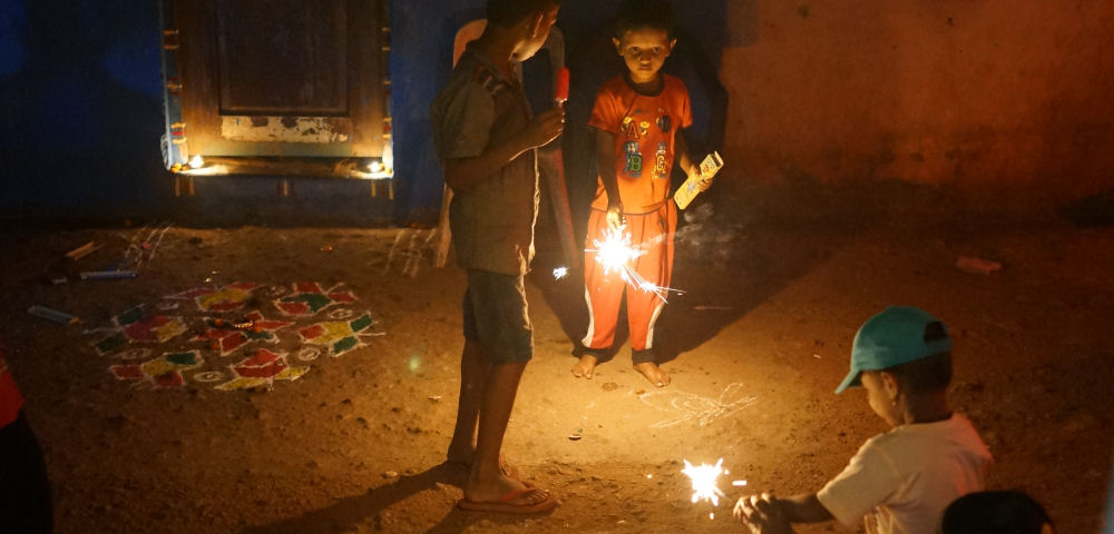 Children playing with Diwali Fireworks