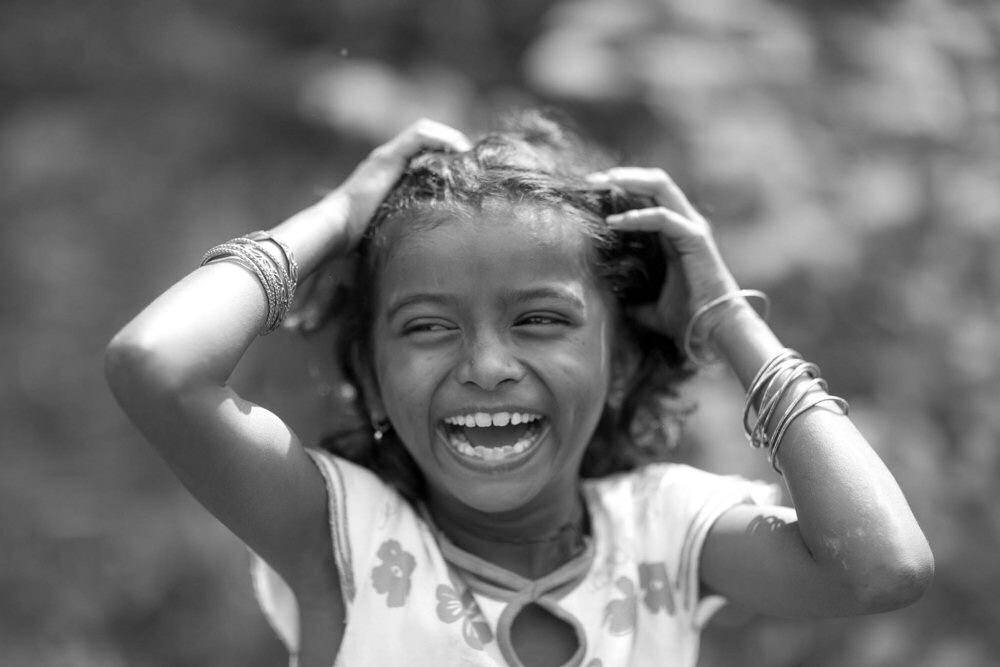 Black And White Photo Of Slum Girl With Huge Smile