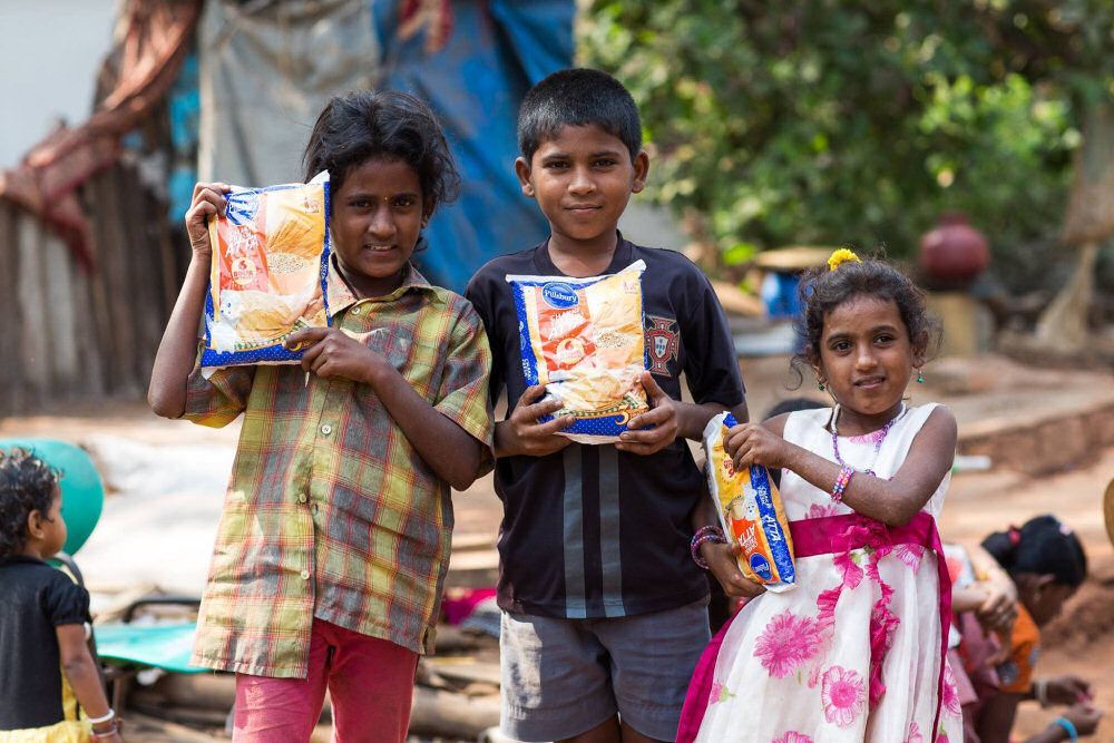 Happy Children Holding Their Donated Flour