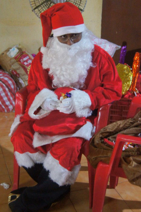 Santa Claus - One of the older girls took great pleasure in being Santa Claus this year.