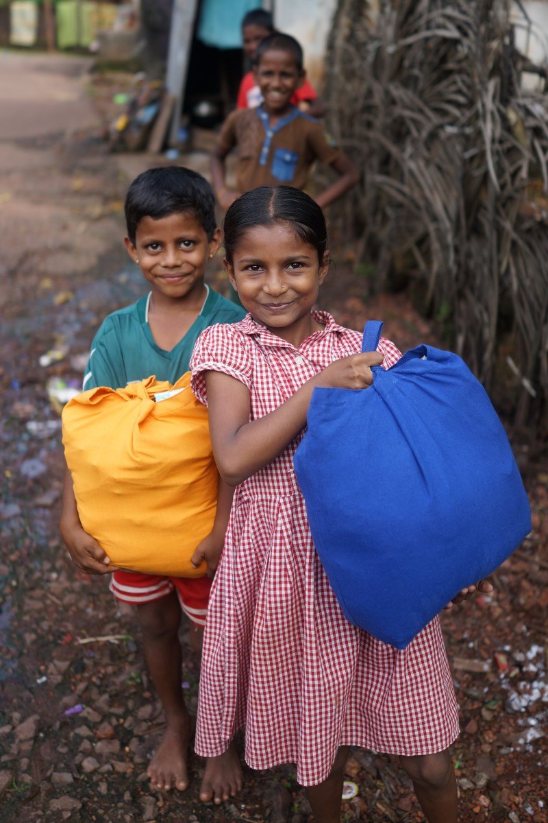 Two Children Holding Their Diwali Bags