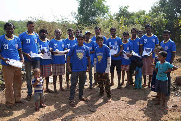 A few of the road workers in their new football shirts