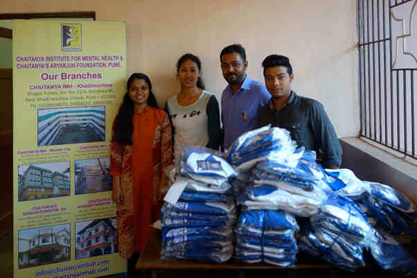 Staff from the Mental Health Centre receiving the donated shirts