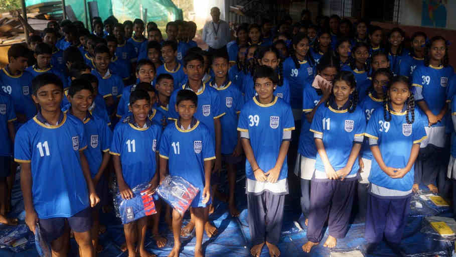 Shree Shanta Vidya Children rceiving their 2 shirts each from Robert and Yallama