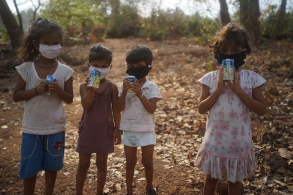 Four Children with the COVID-19 masks on