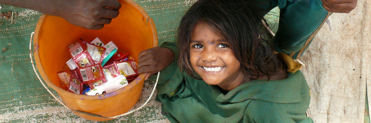 Young Street Child With Donations