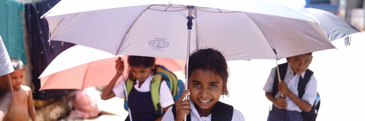 Children Holding Their Umbrellas.