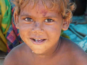 Young Boy sleeping on the path continues to Smile