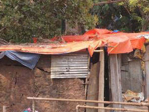 Plastic Sheeting being provided for slums to protect against the monsoon