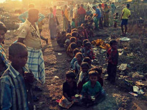 A mass of children waiting for the presents at one are in Mapusa2014/12-Fruit-Circles.jpg|Children split up into small groups so we could give things out more easily...