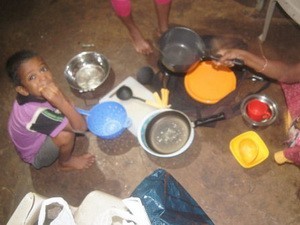 Donations of Pots and Pans Being Distributed in the Slums