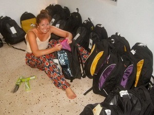 Camille checking to see if the bags have rulers2015/06-Young-Girl.jpg|One of the Young girls in the slum 2015/06-School-Supplies.jpg|Each Bag was filled with the childs school needs
