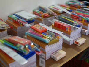 Some of the books and Pencil cases ready to be put into the school bags