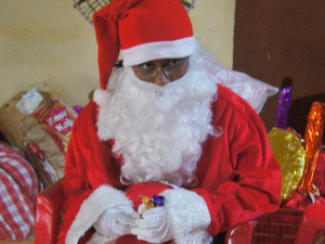 Santa Claus - One of the older girls took great pleasure in being Santa Claus this year.