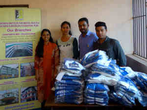 Staff from the Mental Health Centre receiving the donated shirts