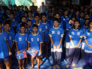 Shree Shanta Vidya Children rceiving their 2 shirts each from Robert and Yallama