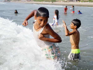 Children enjoying the beach at Ashwem