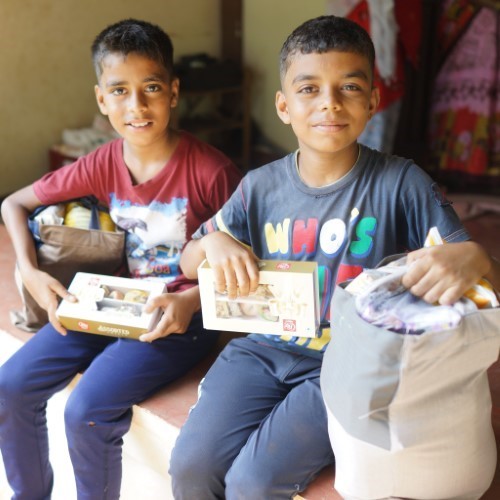 Children With Their Diwali Bags