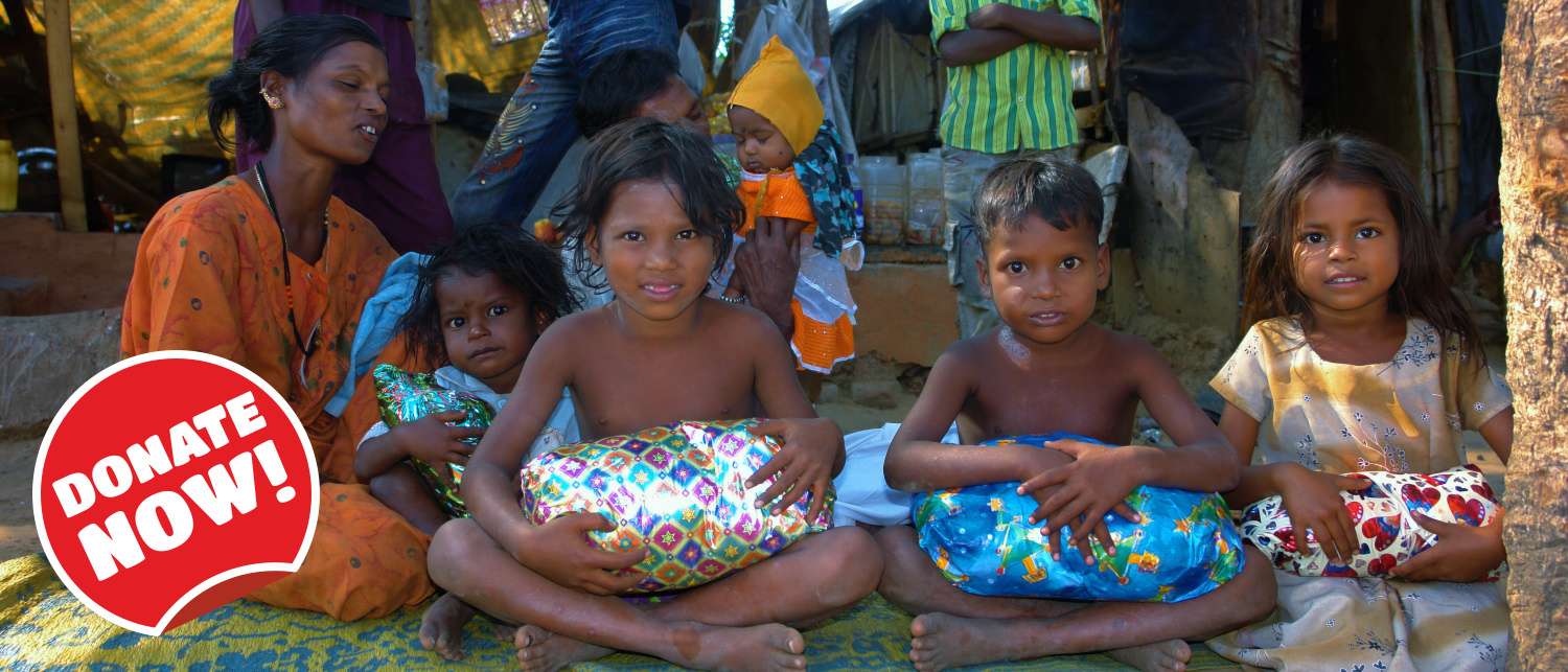 Children receiving Christmas Presents in the Slums